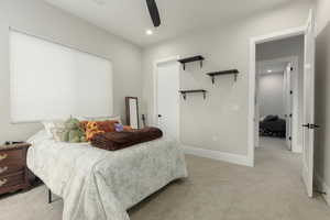 Bedroom featuring light carpet, ceiling fan, recessed lighting, and baseboards