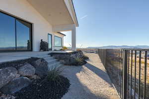 View of yard featuring fence and a mountain view