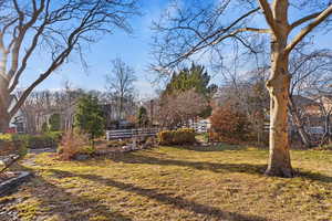 View of yard featuring fence