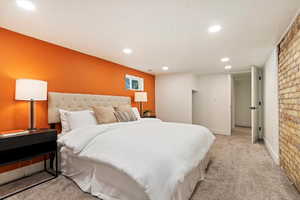 Bedroom featuring recessed lighting, light colored carpet, and baseboards