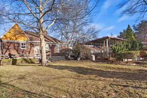 View of yard with a sunroom