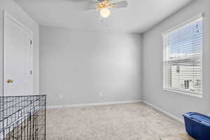 Unfurnished room with baseboards, visible vents, and light colored carpet