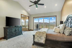 Bedroom with high vaulted ceiling, a mountain view, light carpet, baseboards, and access to outside