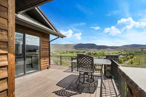 Wooden terrace featuring a mountain view