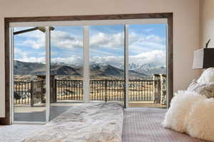 Bedroom featuring access to outside and a mountain view