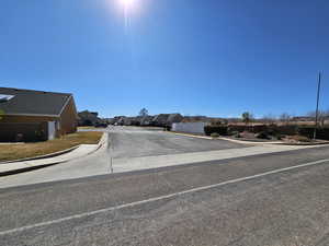 View of street with curbs, sidewalks, and a residential view