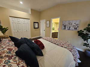 Bedroom featuring recessed lighting, a closet, vaulted ceiling, and baseboards