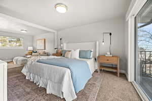 Carpeted bedroom featuring baseboards