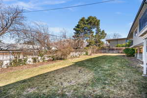 View of yard featuring a fenced backyard