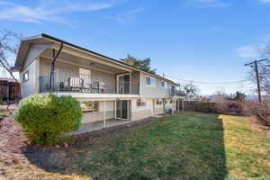 Back of property with a yard, central AC unit, a patio area, and fence