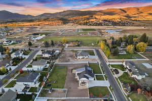 Birds eye view of property with a residential view and a mountain view