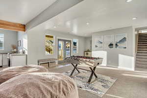 Playroom featuring recessed lighting, french doors, and light carpet