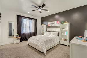 Bedroom with light carpet, baseboards, a ceiling fan, and recessed lighting