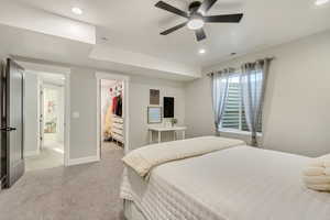 Bedroom featuring recessed lighting, visible vents, light colored carpet, a spacious closet, and baseboards