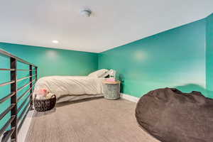 Bedroom featuring recessed lighting, carpet, and baseboards