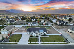 Aerial view at dusk featuring a residential view and a mountain view