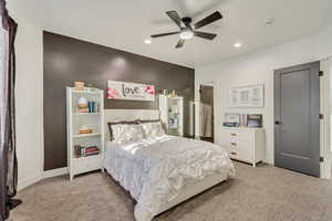 Bedroom featuring baseboards, ceiling fan, recessed lighting, and light colored carpet