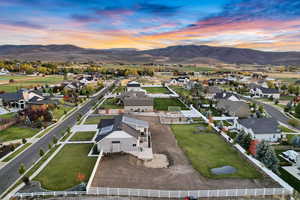 Aerial view at dusk with a residential view and a mountain view