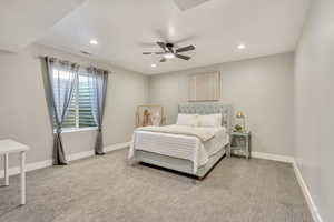 Bedroom with recessed lighting, light colored carpet, and baseboards