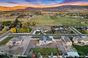 Aerial view at dusk with a mountain view and a residential view