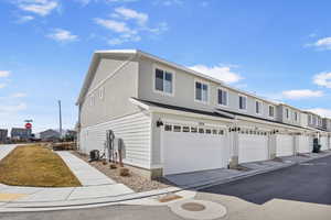 View of front of house featuring a residential view and central AC