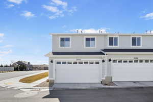 View of front of property with concrete driveway