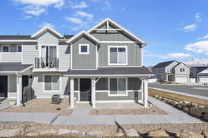 Multi unit property with a shingled roof, a balcony, a residential view, cooling unit, and board and batten siding