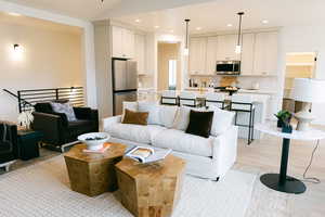 Living room featuring recessed lighting and light wood finished floors