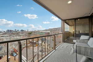 Balcony accessible from Primary Bedroom featuring a mountain view and a city view