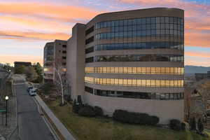 View of property at dusk