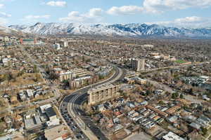 Drone / aerial view featuring a view of city and a mountain view