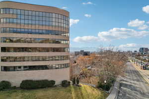 View of building exterior featuring a view of city and a mountain view