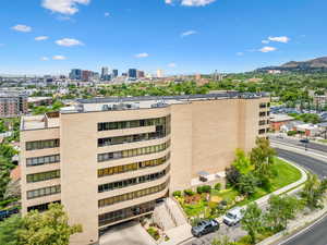 View of property with a mountain view and a city view