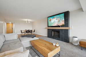 Living area featuring a fireplace and baseboards