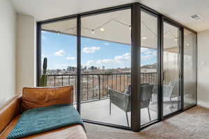 Interior space featuring a view of city and visible vents