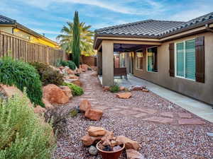 View of yard with a ceiling fan, a patio area, and a fenced backyard