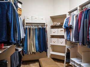 Spacious closet featuring light tile patterned floors