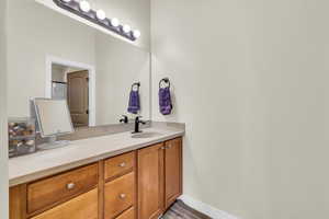 Main Bathroom featuring a sink, and double vanity