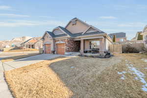 View of front of house with a garage, a shingled roof, concrete driveway, a residential view, and fence