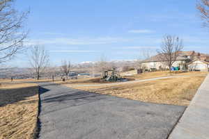 View of street with sidewalks and a mountain view