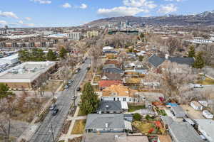 Birds eye view of property with a residential view and a mountain view