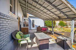 View of patio / terrace with fence and an outdoor hangout area