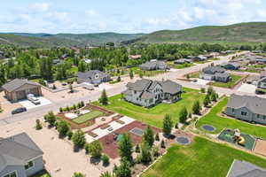 Birds eye view of property with a residential view and a mountain view