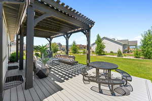 Deck with a residential view, a lawn, an outdoor hangout area, and a pergola