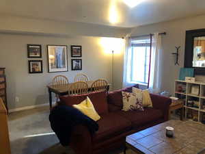 Living area with carpet floors and baseboards