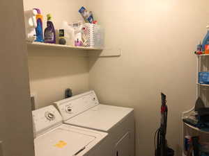 Laundry room with washing machine and dryer and laundry area