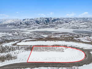 Snowy aerial view featuring a mountain view