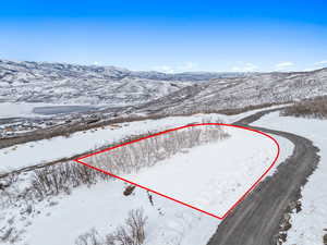 Snowy aerial view with a mountain view