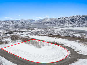 Snowy aerial view with a mountain view