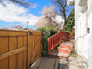 View of patio featuring a gate